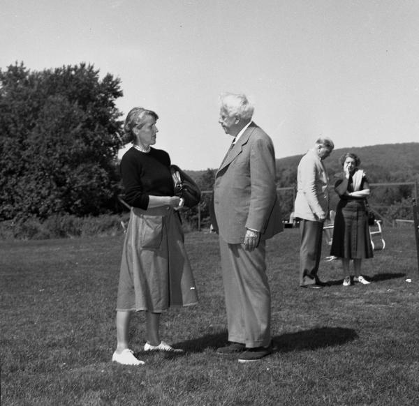 Catherine Drinker Bowen and Robert Frost. Bread Loaf campus, Ripton, Vt.; August 1950. Writers' Conference faculty member Catherine Drinker Bowen with Robert Frost. Kay Morrison and Richard Brown are in the background.